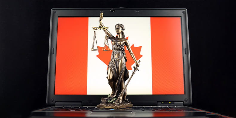 Canada Flag on a Laptop with Temida on Focus