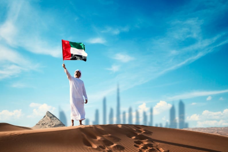 Man holding UAE flag